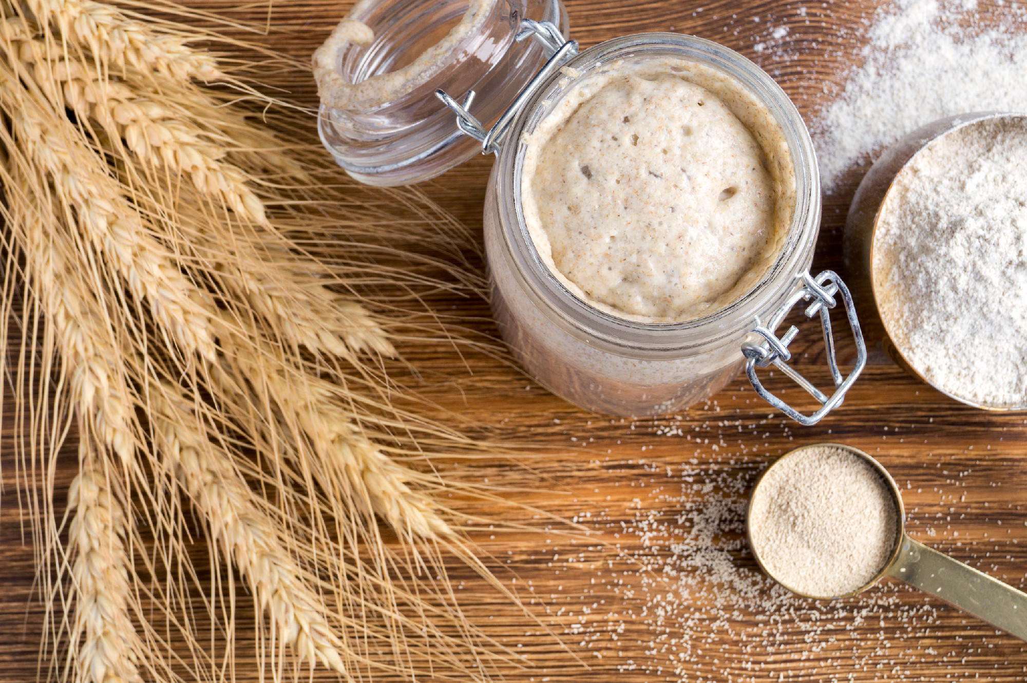 Active rye sourdough in a glass jar for homemade bread.