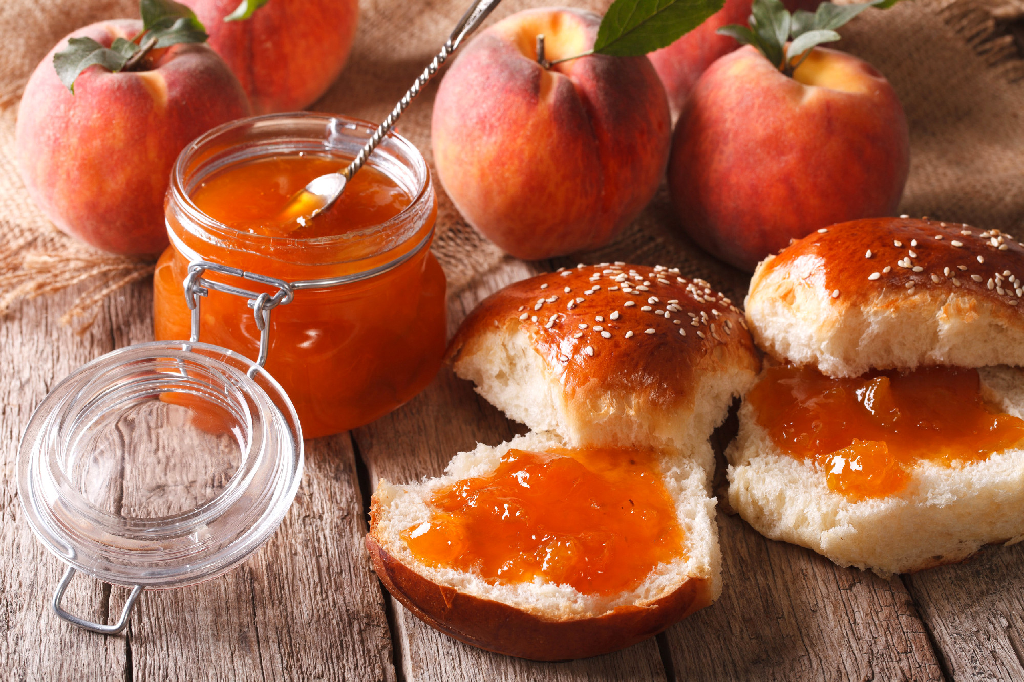 Homemade buns with peach jam close-up on the table. Horizontal