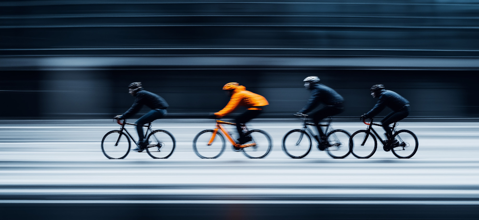 Cycling in the city. Motion blurred people riding bicycles in the city. Urban cycling