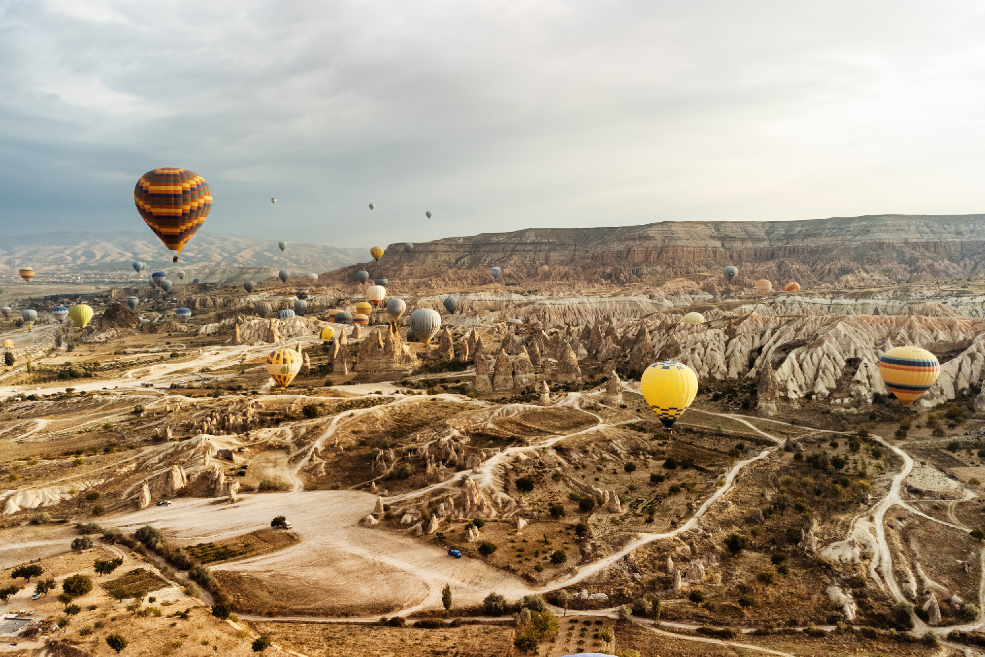 Hot air balloons flying over Goreme Historical National Park
