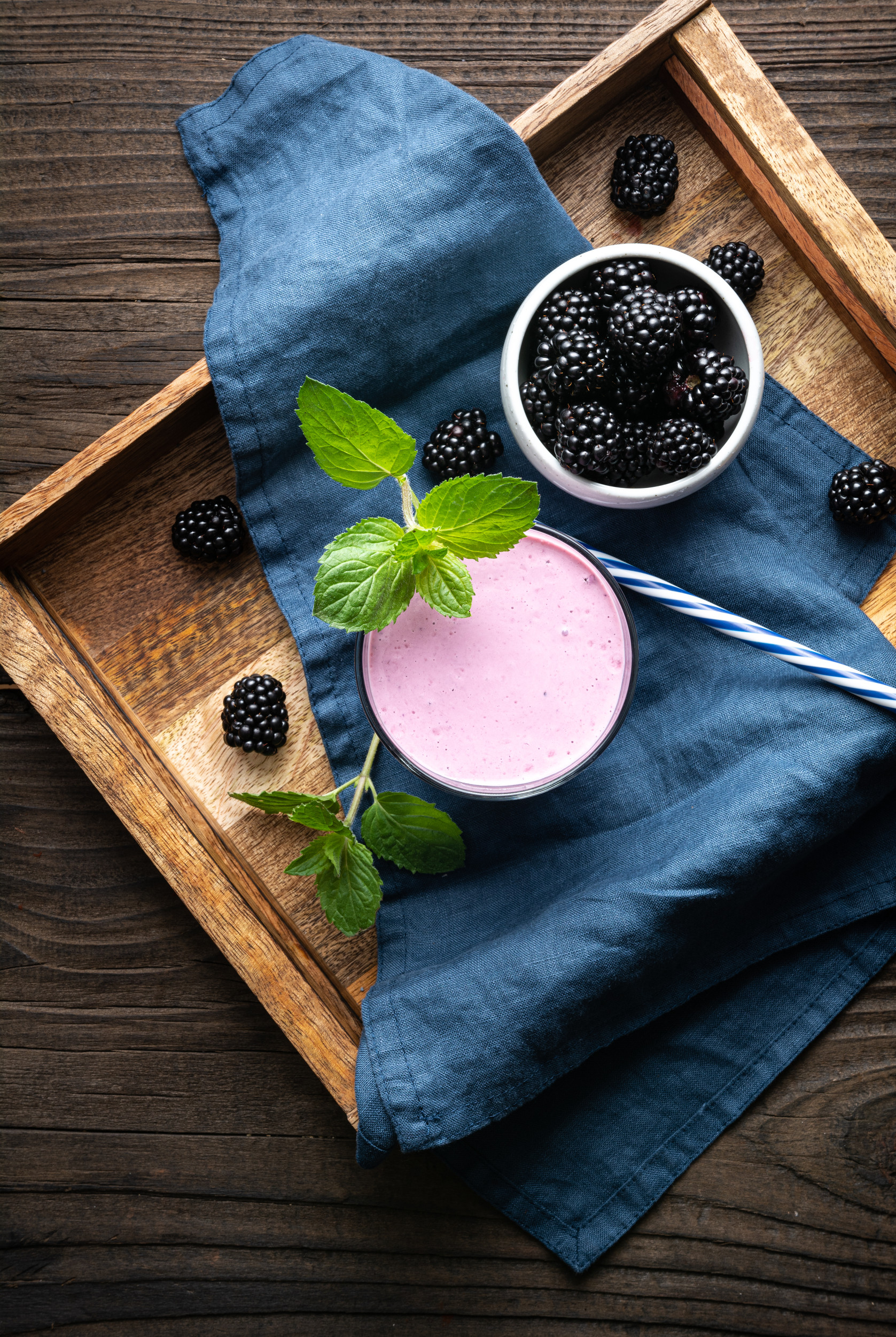 Sweet dairy drink, blackberry milkshake in a glass
