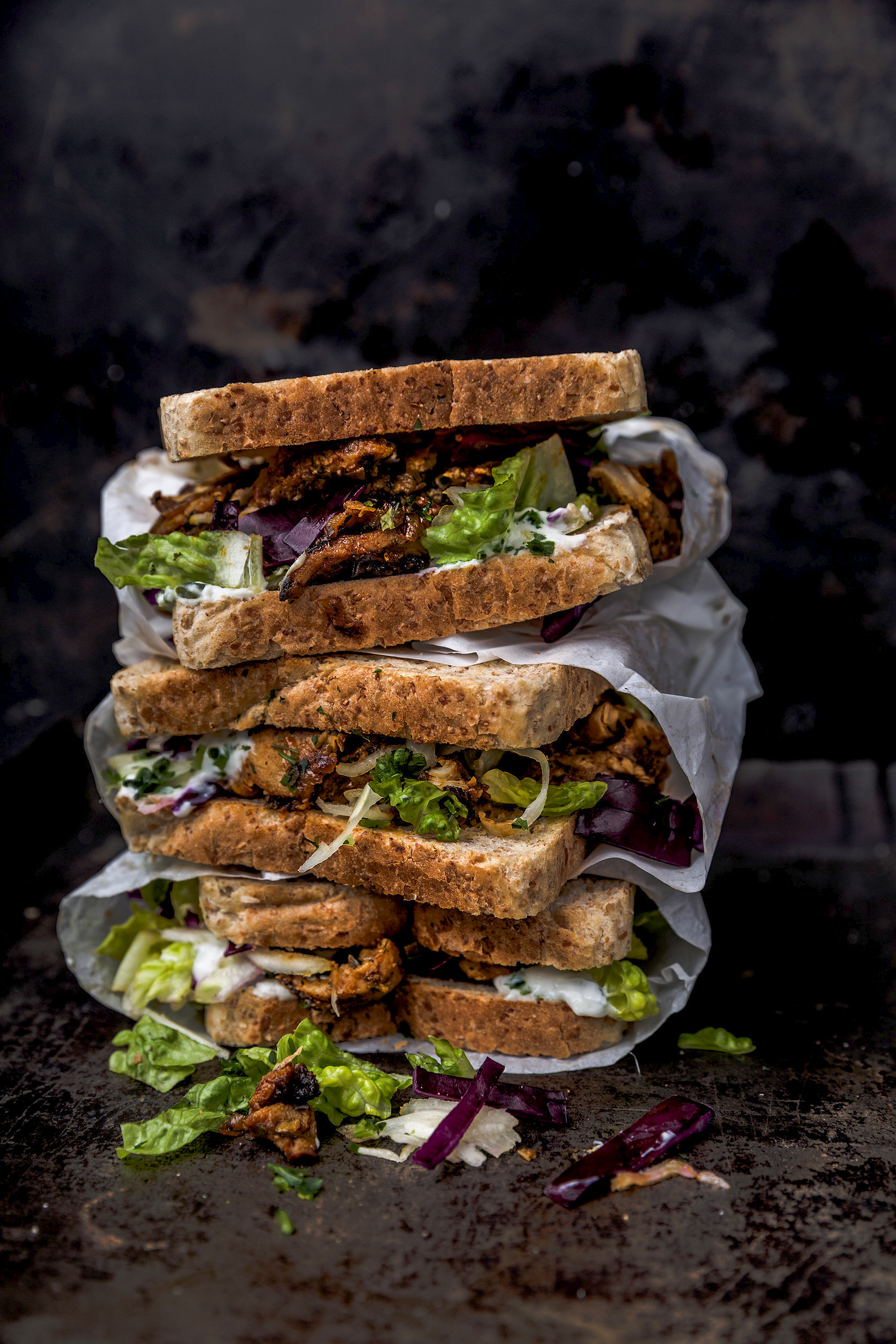 delicious gyros sandwich in paper bag with salad