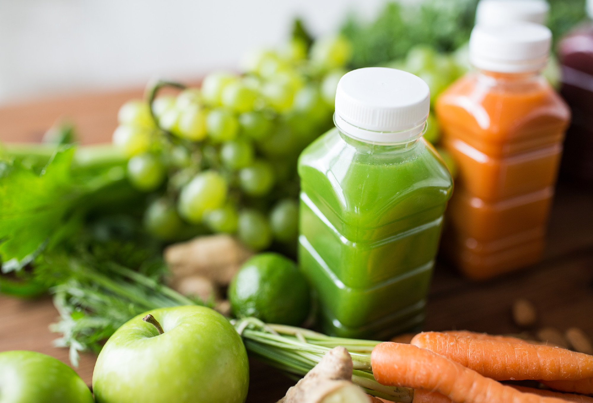 bottles with different fruit or vegetable juices