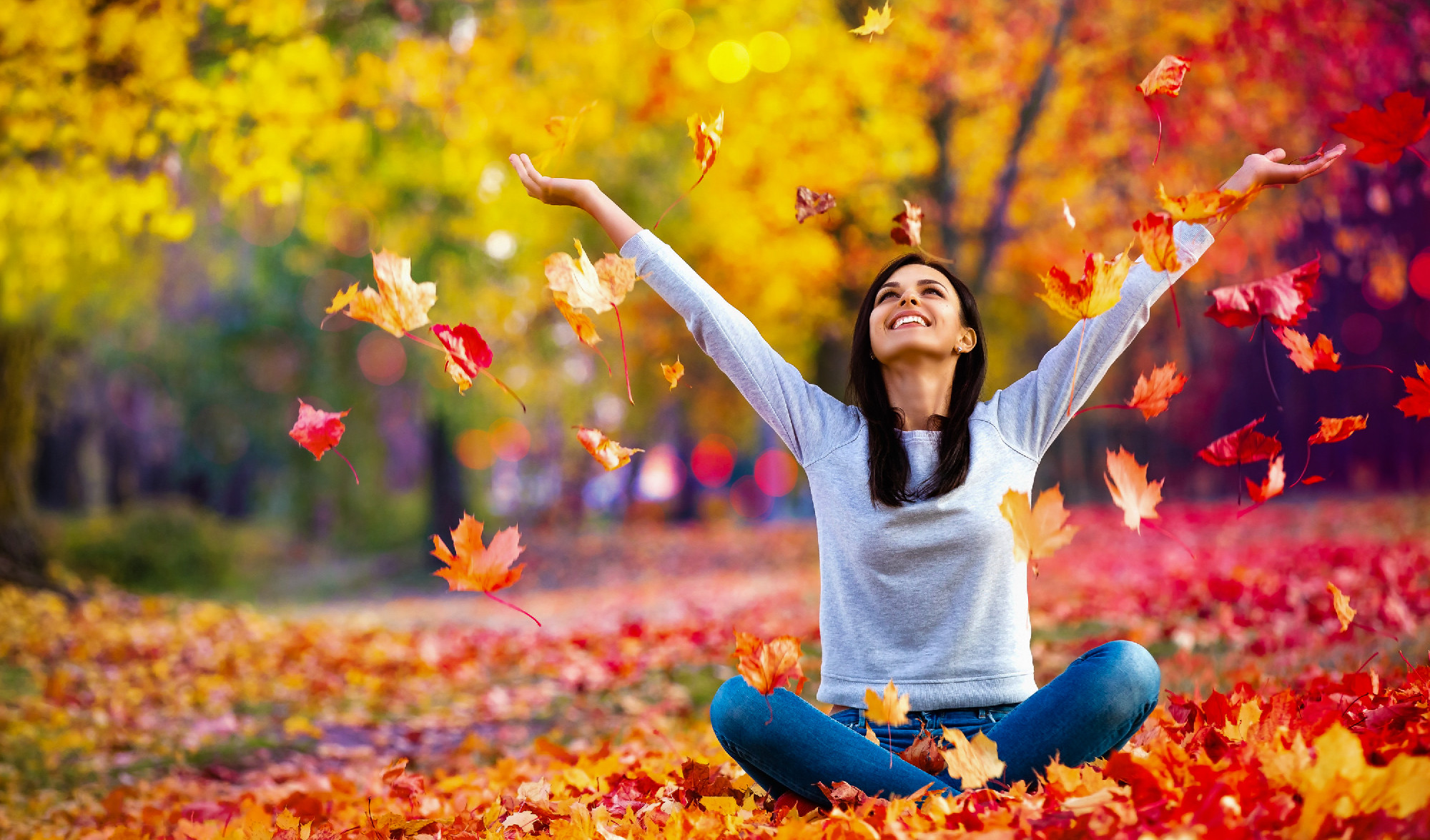 Happy Woman Enjoying Life in the Autumn