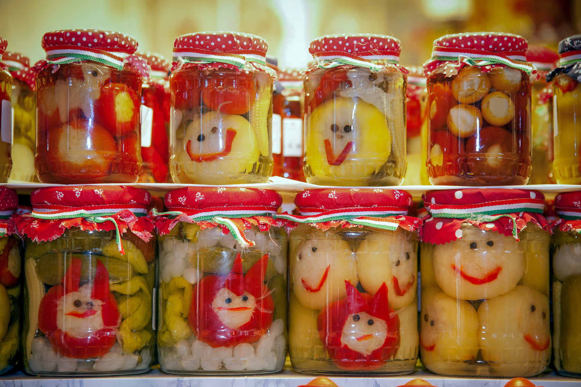Funny jars of pickled vegetables on town market Budapes Hungary