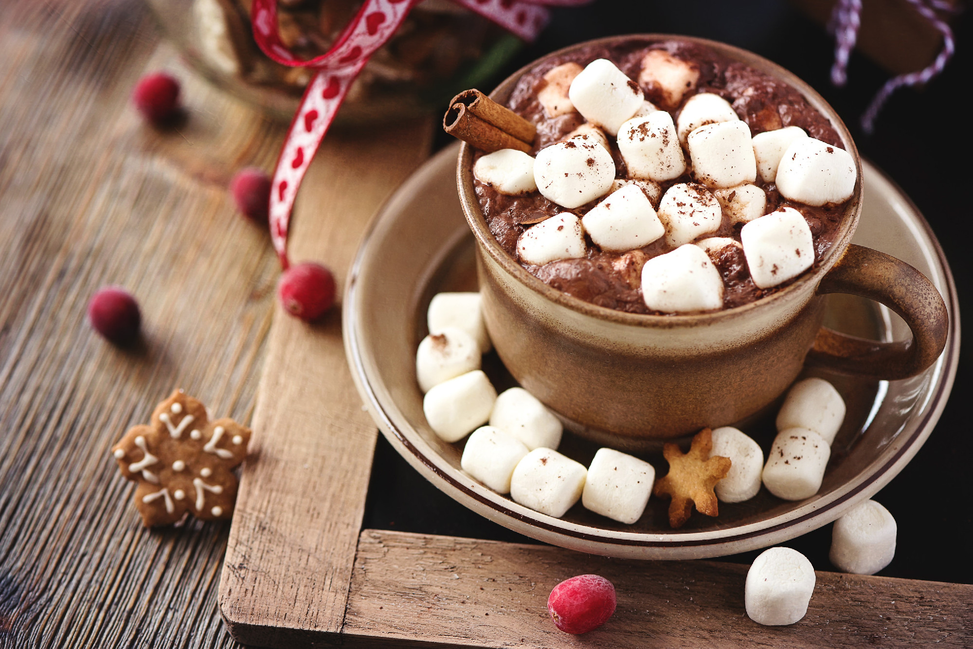 Hot cacao drink with marshmallows, gift box and christmas cookie