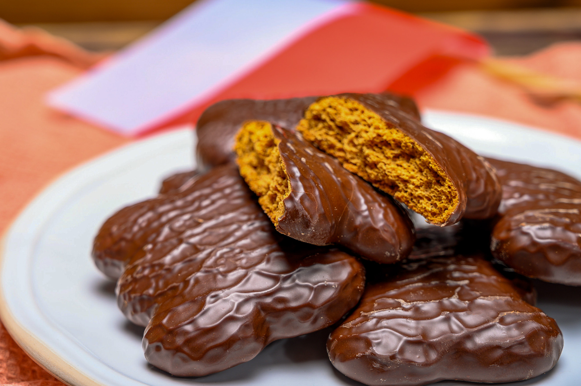Tasty gingerbread glazed cookies from Torun, Poland and flag of