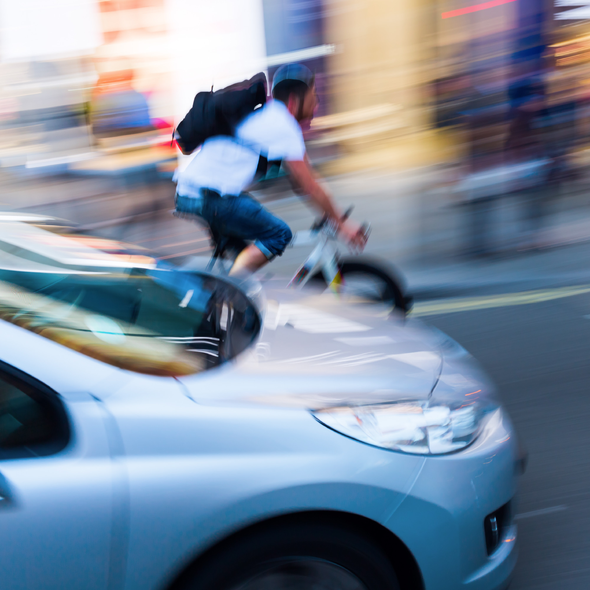 cyclist and car in motion blur