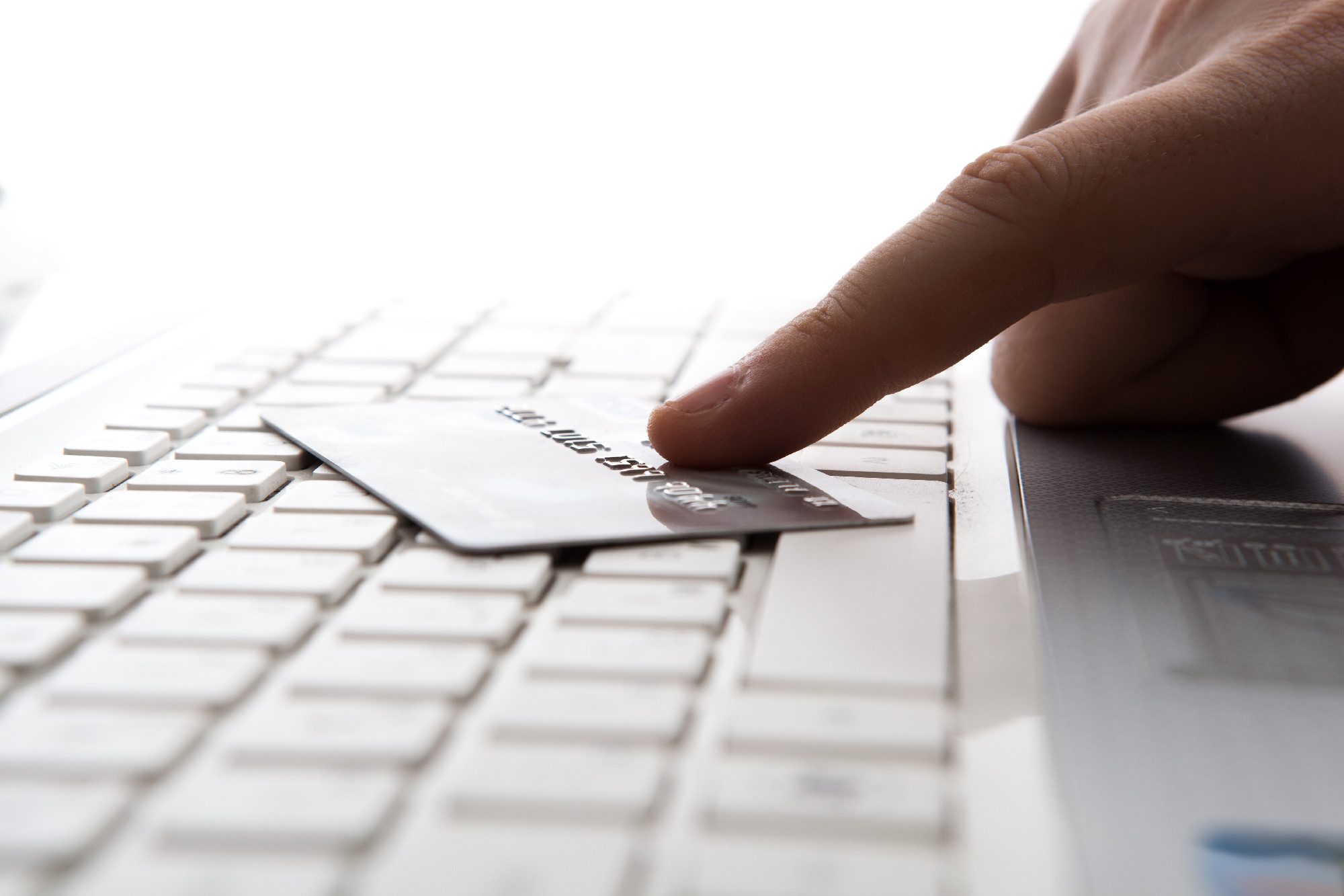 bank card on laptop keyboard