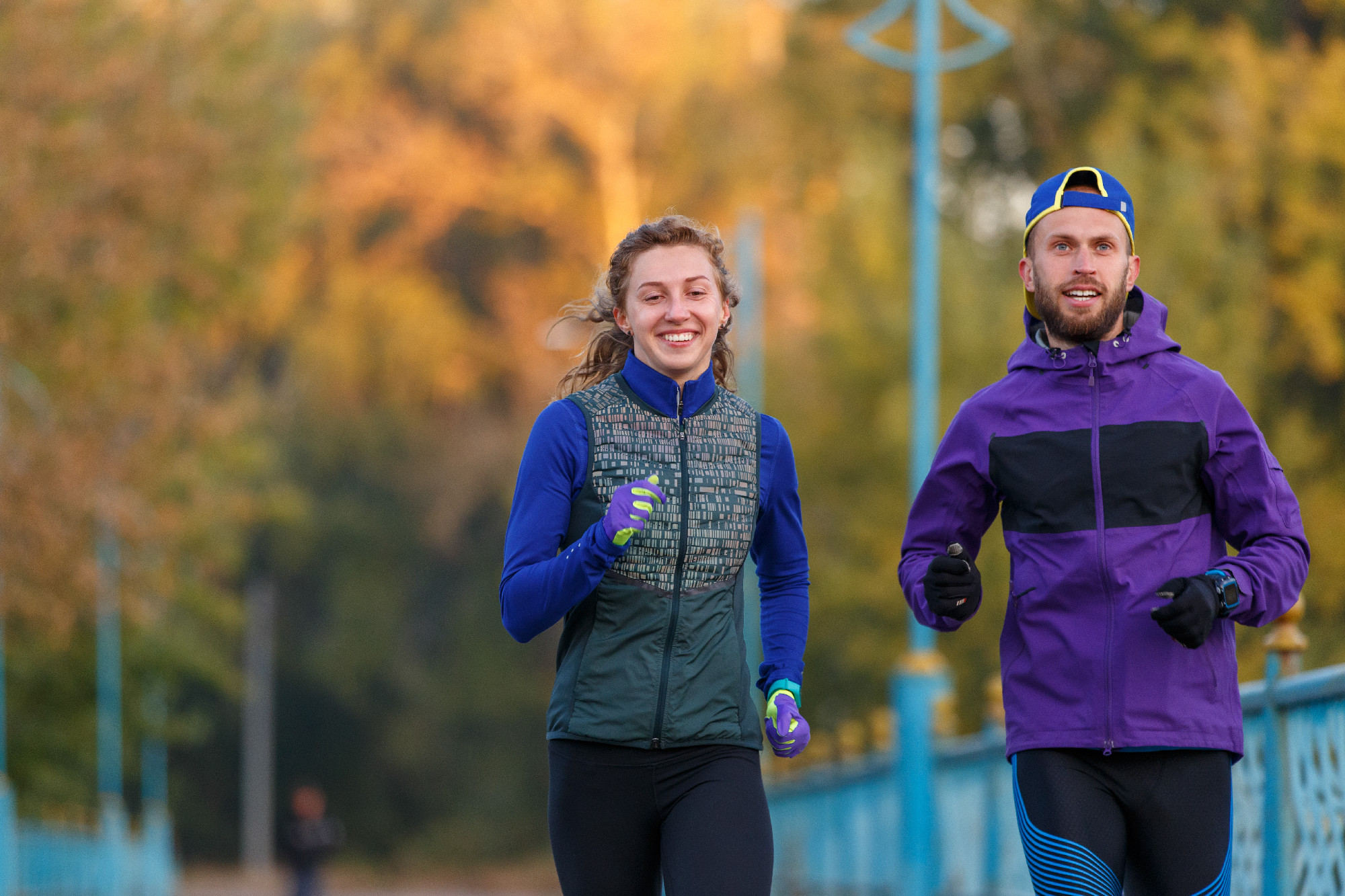 Runners fitness couple running in the city park