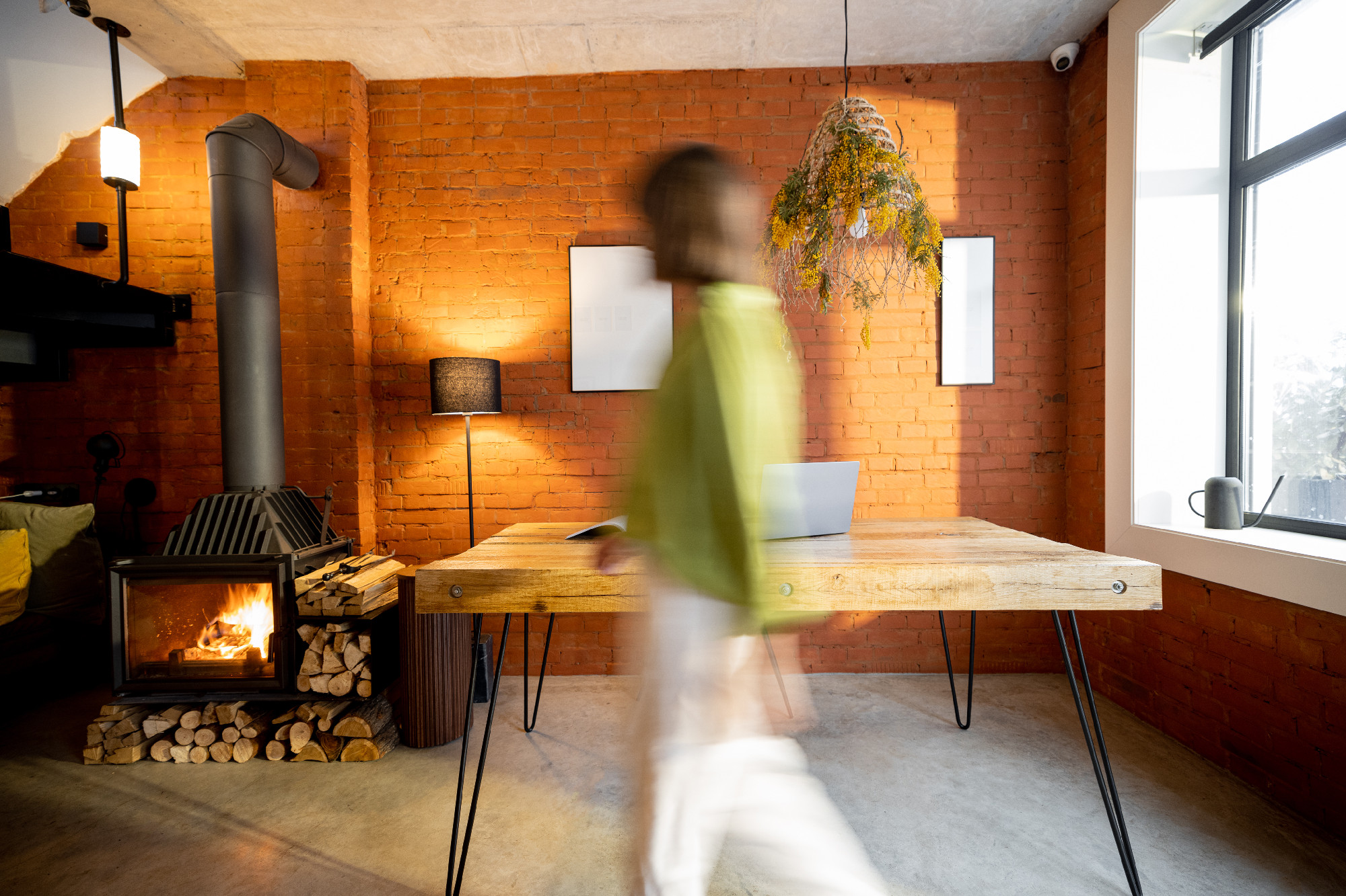 Living room interior in loft style and motion blurred person