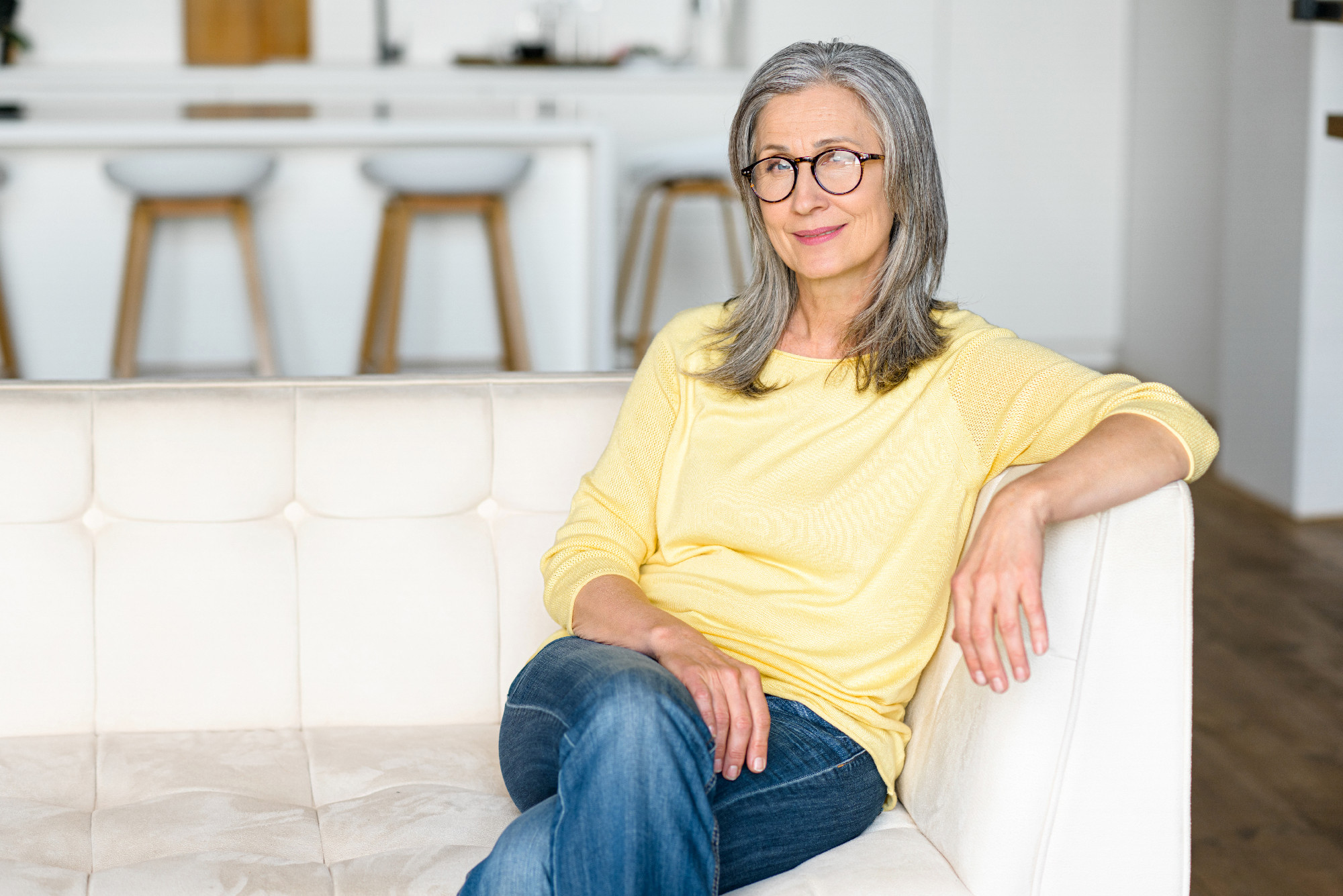 Portrait of smiling mature woman in casual wear and glasses