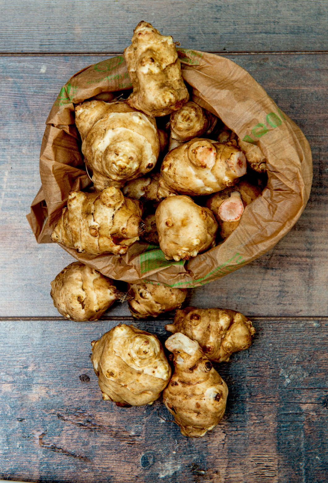 Jerusalem artichoke on wooden background