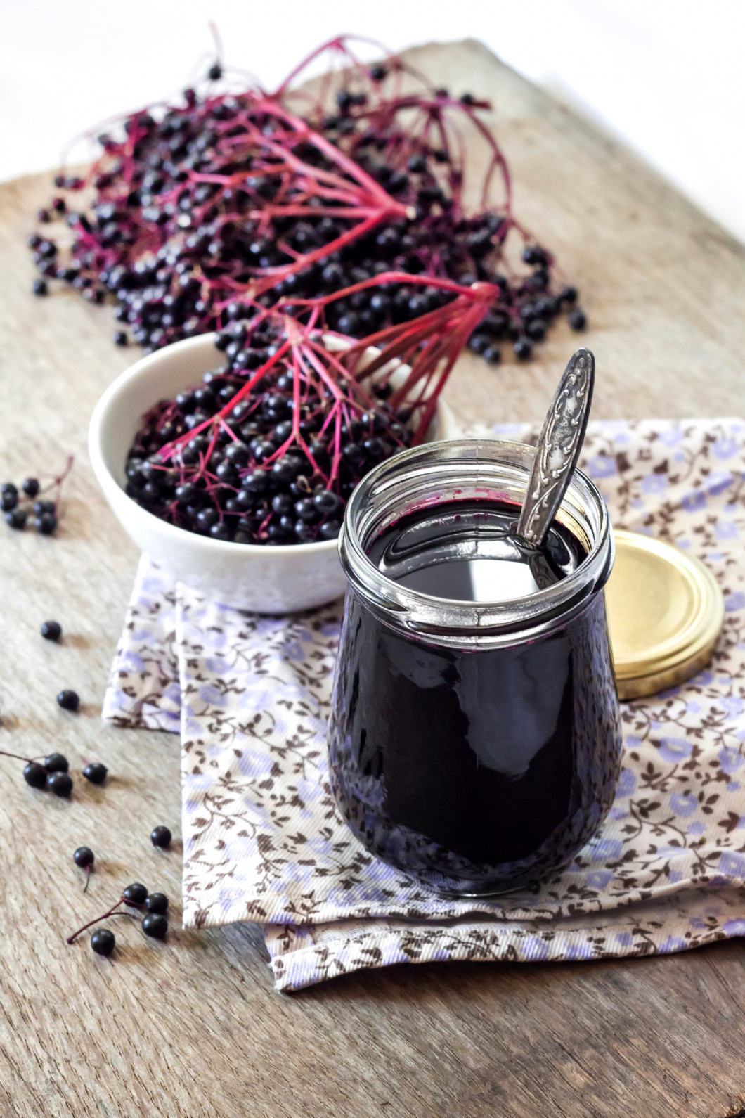 Homemade black elderberry syrup in glass jar 