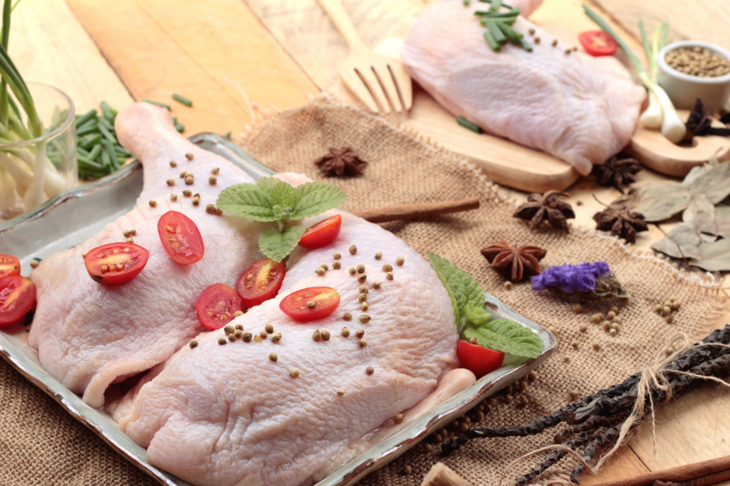 Fresh chicken and tomatoes with spices for cooking