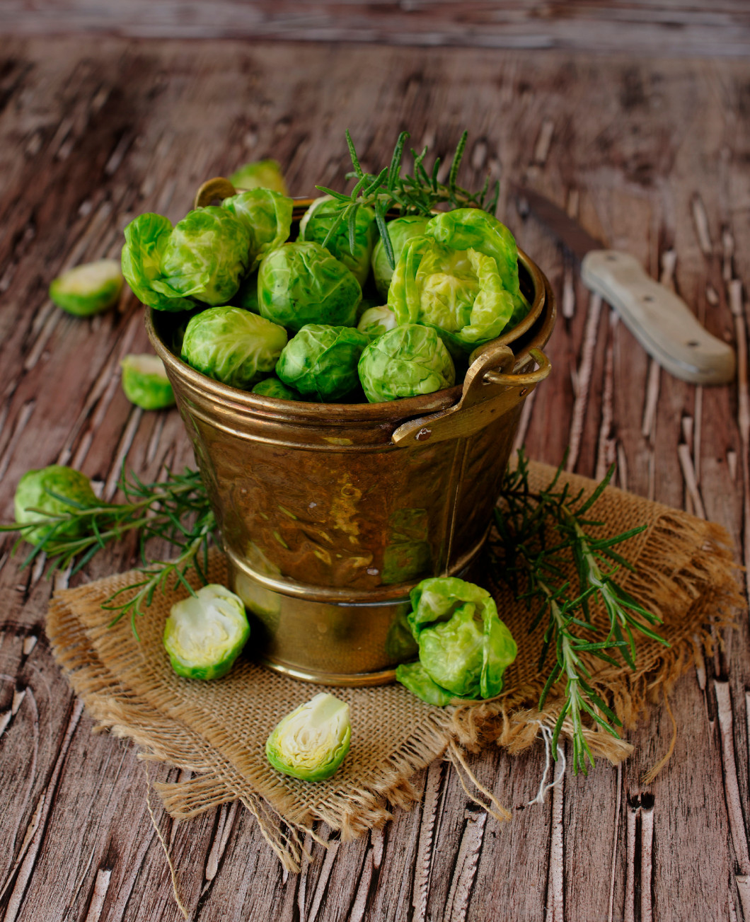 green raw brussels sprouts in t bucket , selective focus