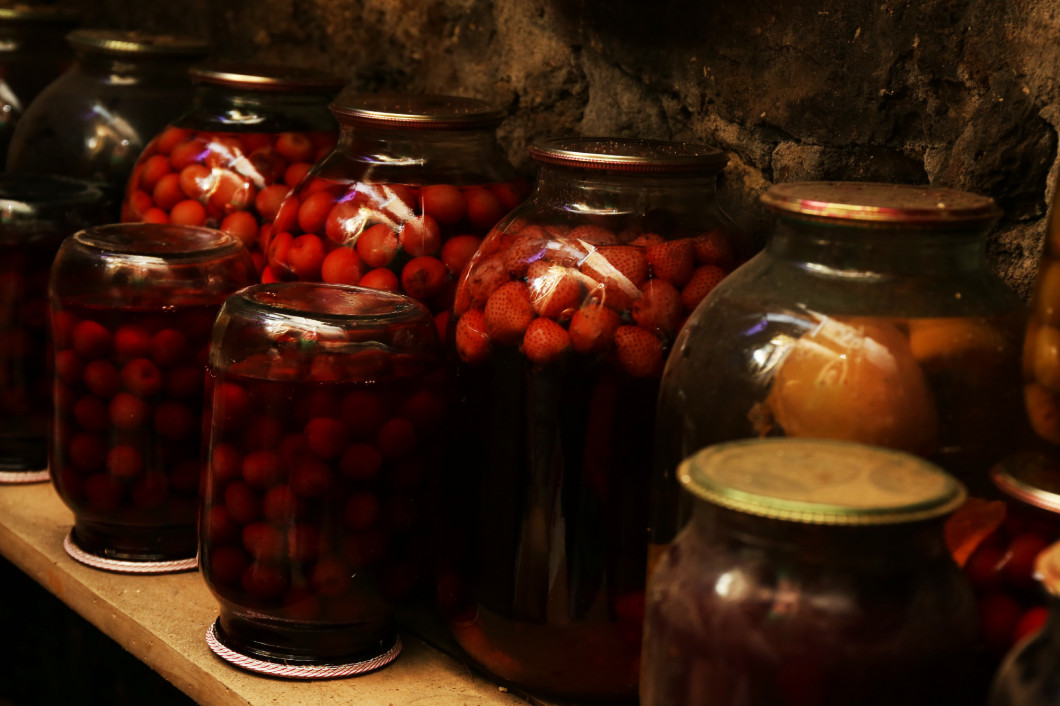 Home preservation in glass jars in cellar, closeup