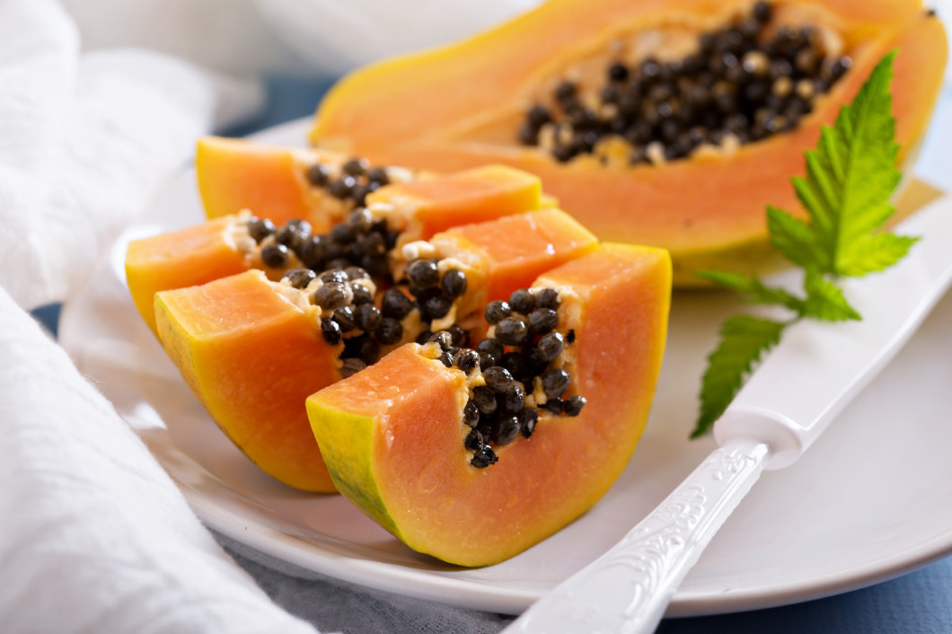 Cut papaya on a blue table