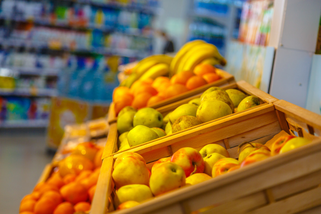 Shopping showcase in the supermarket with vegetables and fruit.