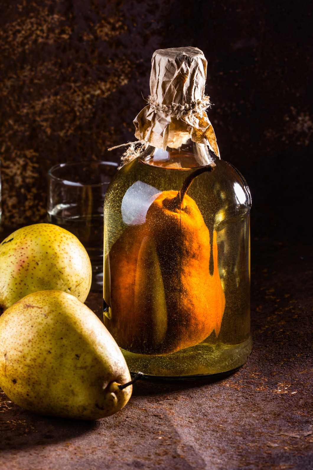 Chilean brandy with whole pear inside bottle. Aguardiente de pera