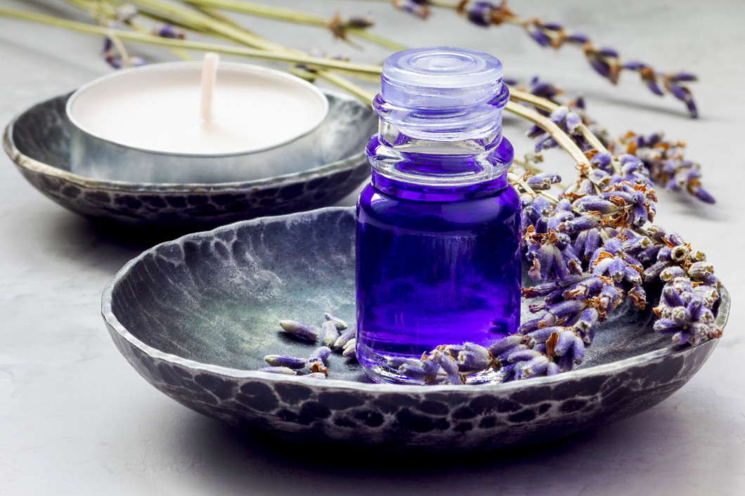Lavender oil in a glass bottle. Horizontal close-up