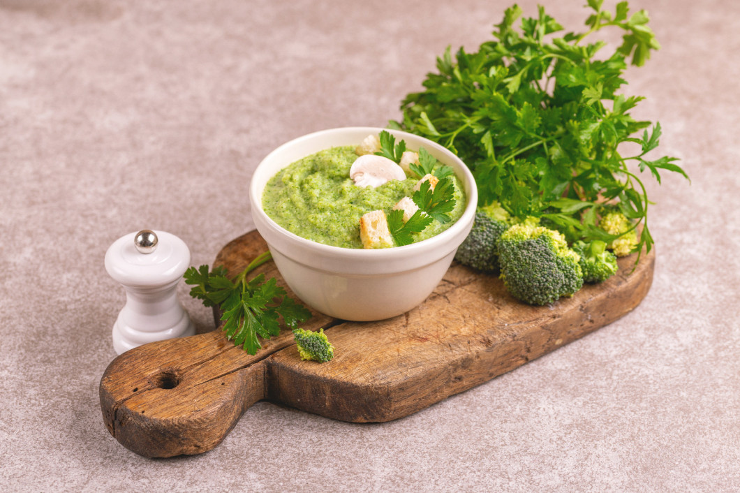 Fresh tasty pureed broccoli soup with vegetables. Healthy food