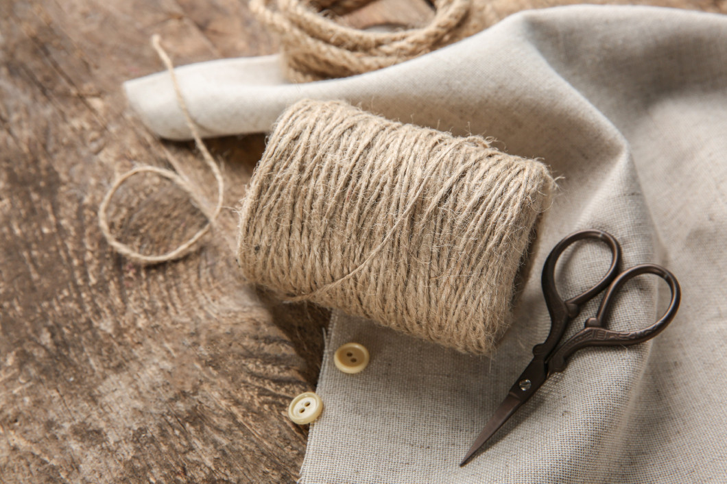 Composition with hemp twine and rope on wooden background�