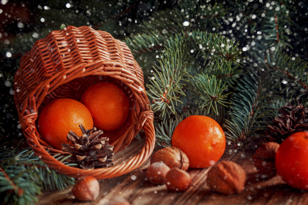 Christmas  composition wicker Basket with tangerines, cones, nut