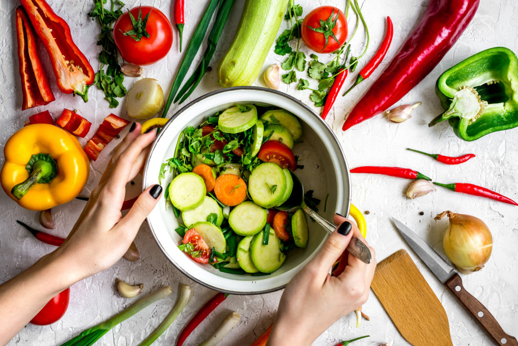 cooking vegetables on the stone background top view