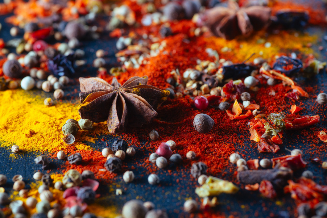 Different colorful seasonings close-up chalk board