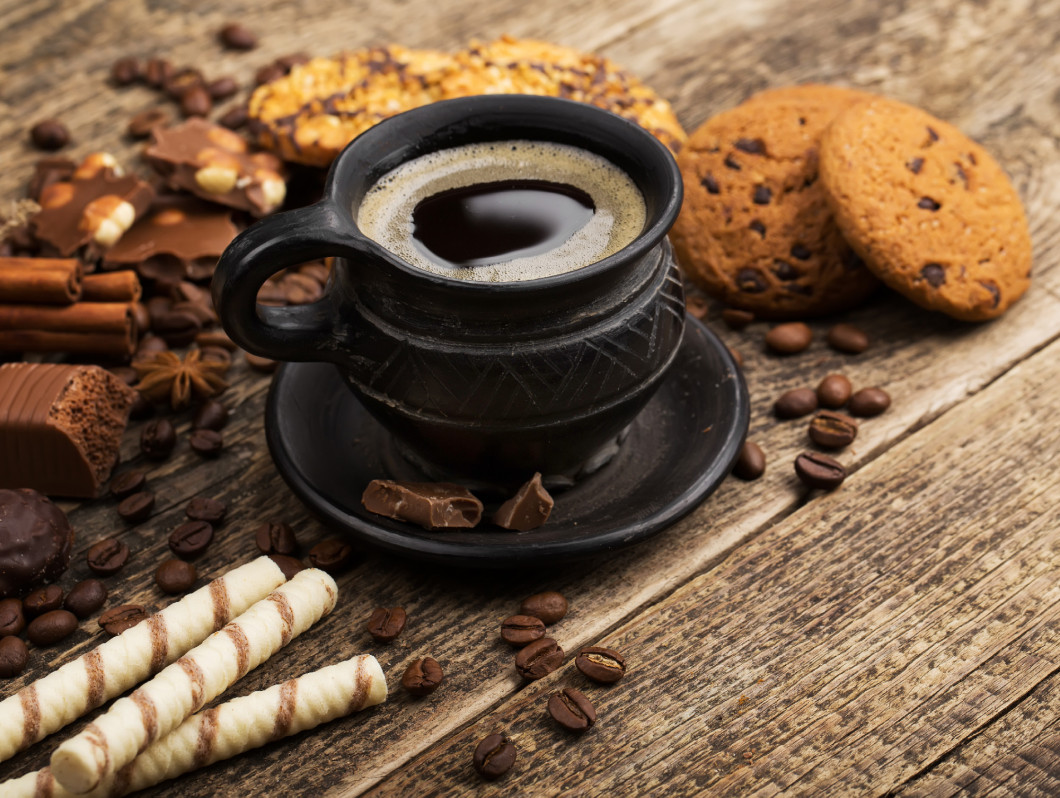 coffee and cookies on wood background