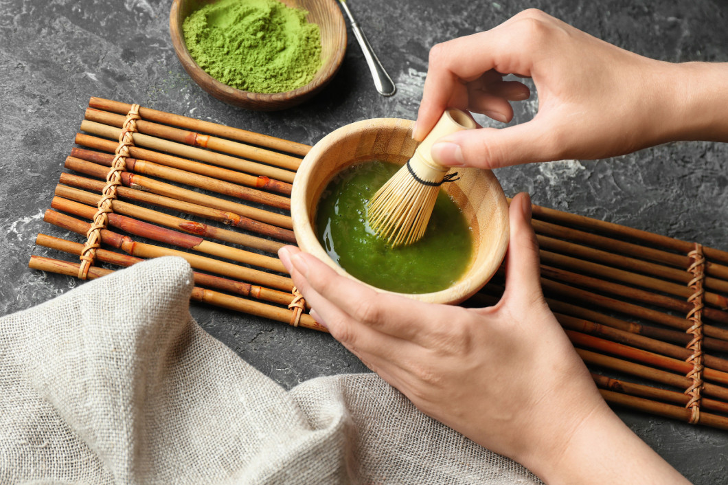 Woman preparing matcha tea, closeup�