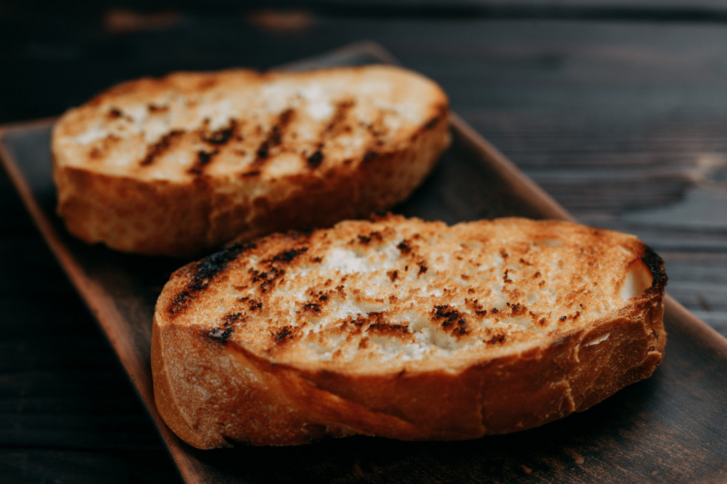 Appetizing crunchy grilled toasts of wheat bread, breakfast conc