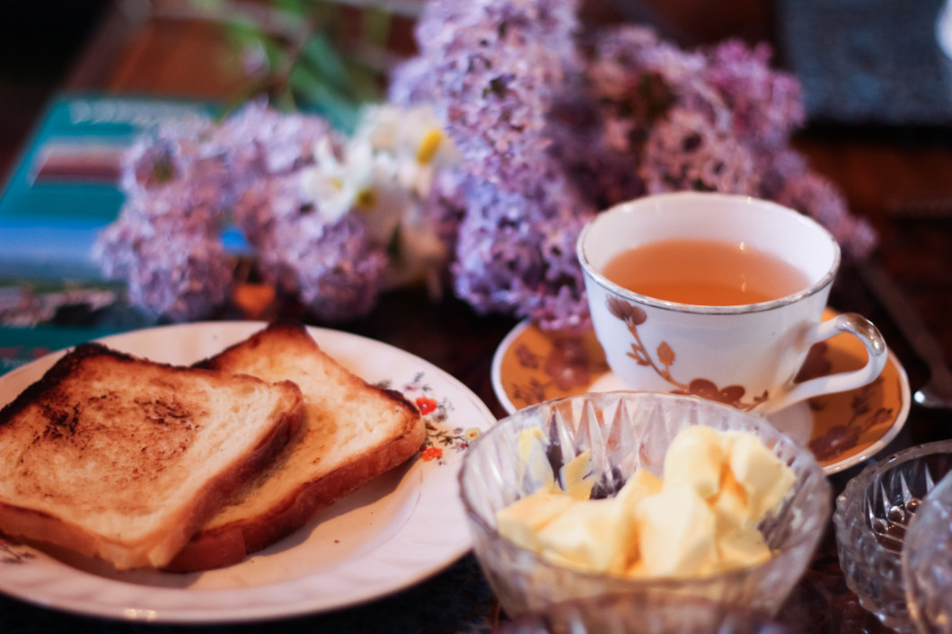 masala chai tea of india with bread, butter and lilac flower