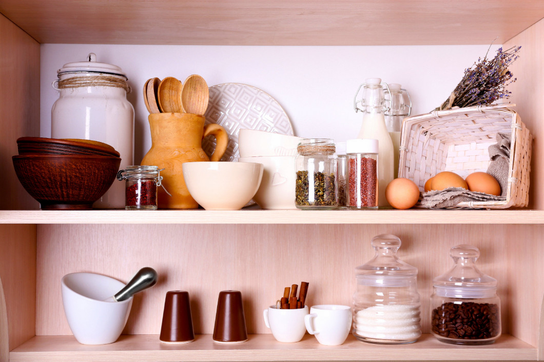 Kitchen utensils and tableware on shelves