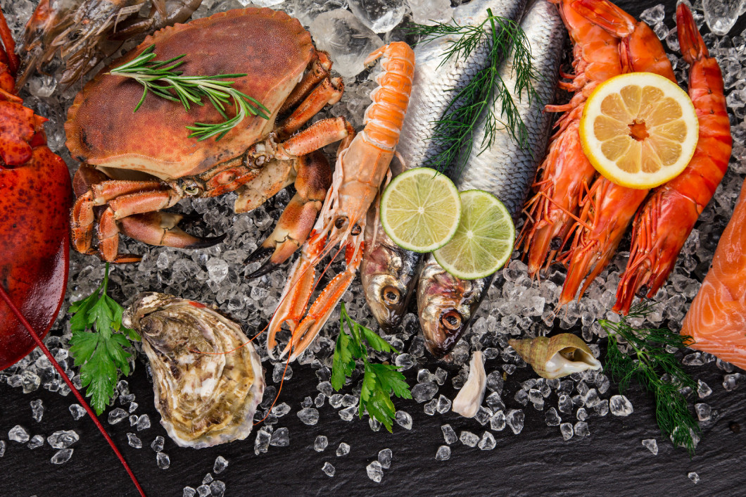 Fresh tasty seafood served on old wooden table.