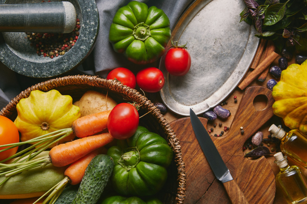 Recipe template with fresh vegetables and kitchen utensils on wooden table