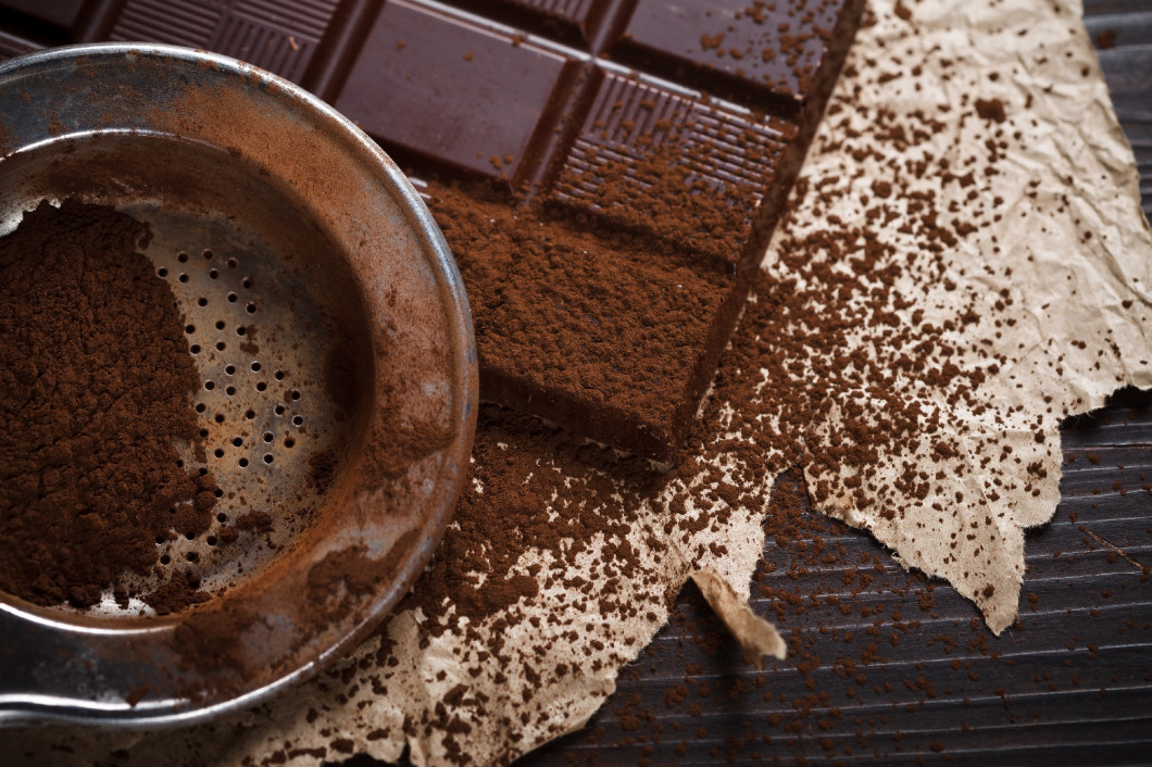 Cocoa dust on silver sieve