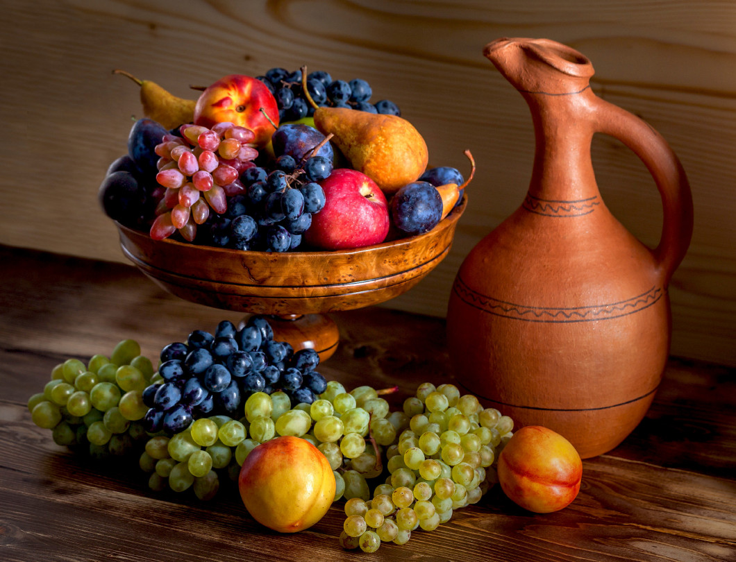 autumnal fruit still life with Georgian jug on rustic wooden tab