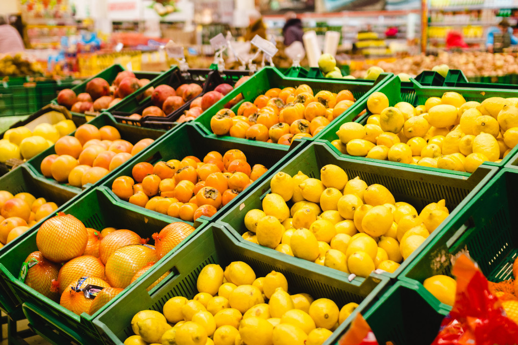 Image of shelves with variety testy vitamin products in fruit and vegetables department in the supermarket.