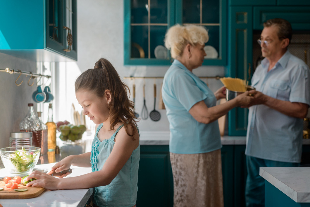 Granddaughter helps to cook