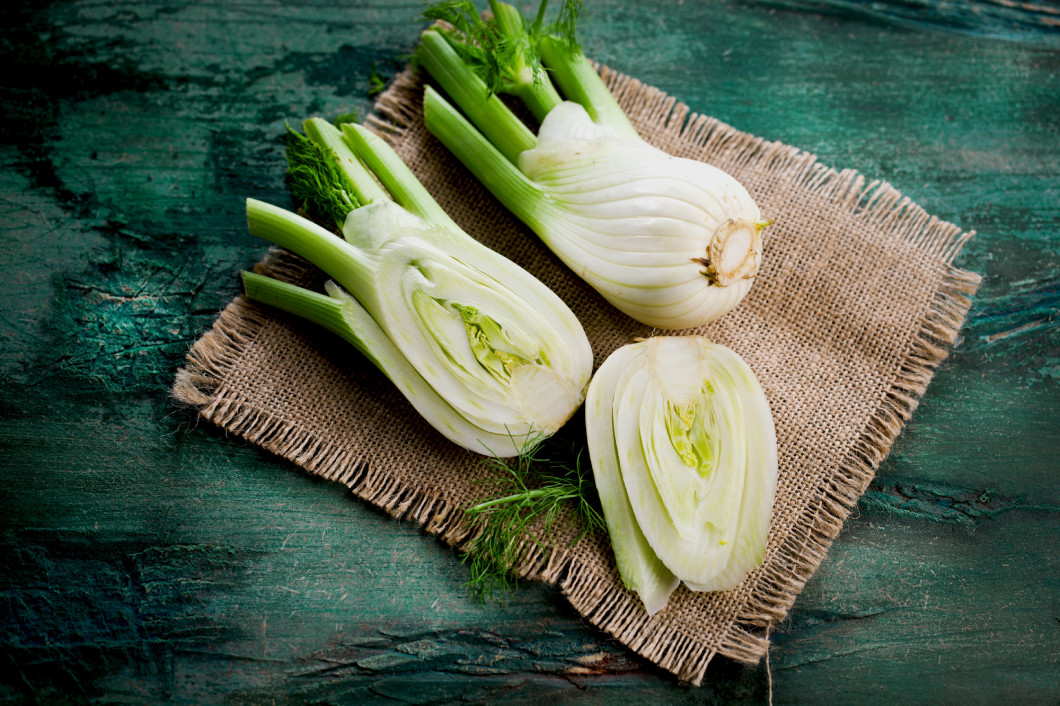 Fresh Florence fennel bulbs or Fennel bulb on wooden background.