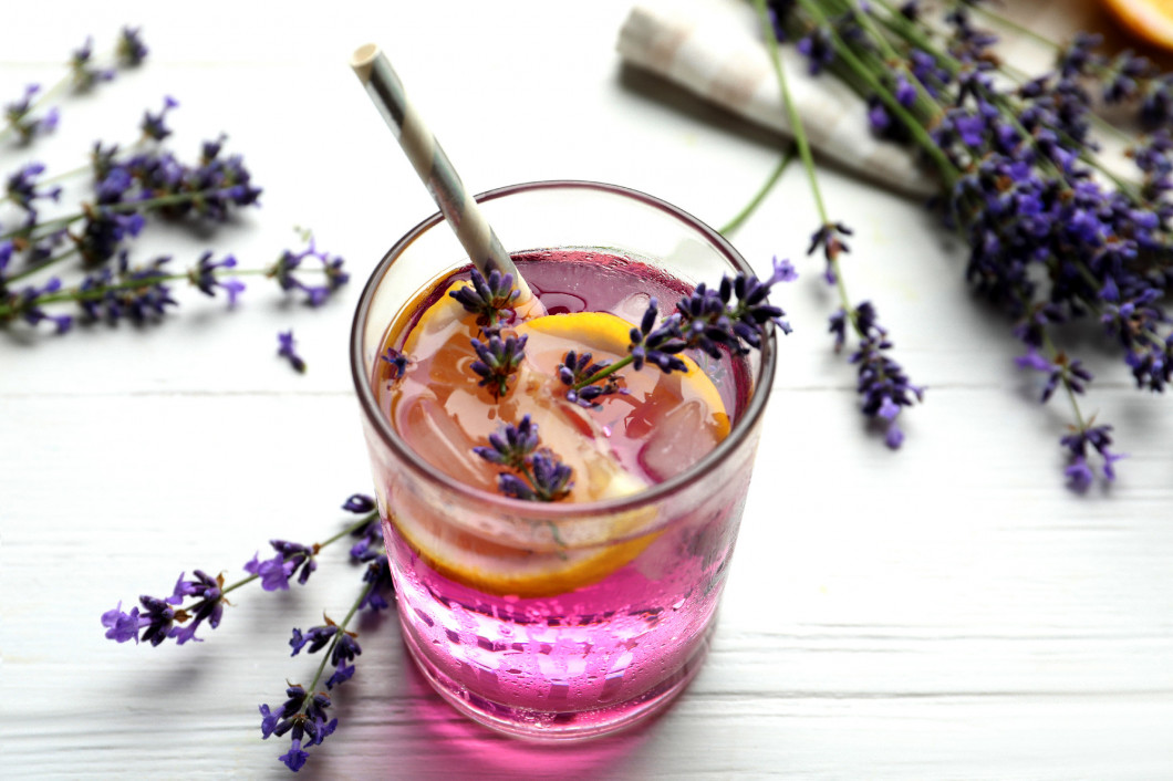 Fresh delicious lemonade with lavender on white wooden table