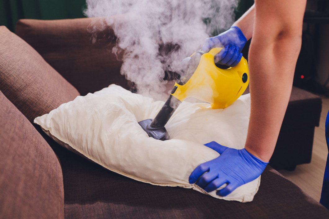 Using dry steam cleaner to sanitize pillow.