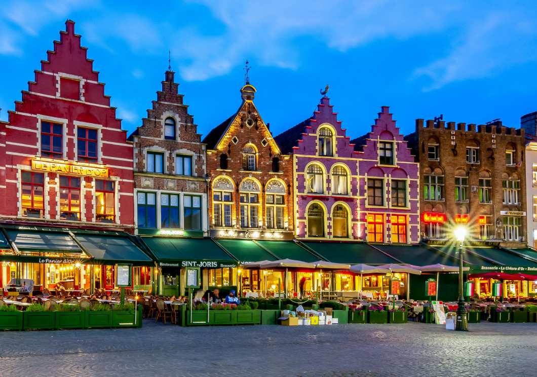 Bruges, Belgium - June 2019: Cafes and restaurants on Brugge mar