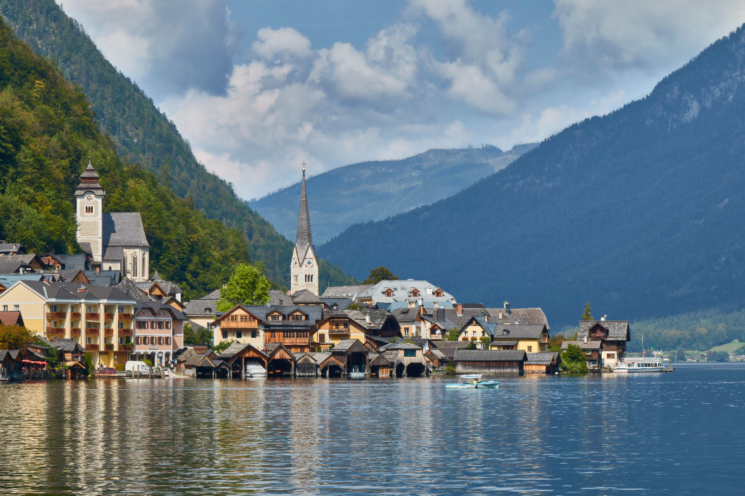 Hallstatt village landscape with old buildings reflected in blue