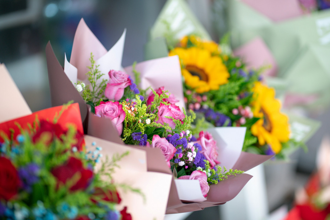 Roses and other flowers bouquet in a florist shop.